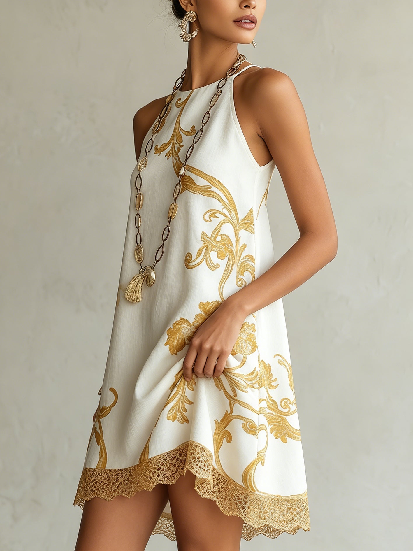 MINIVESTIDO DE ENCAJE ESTAMPADO EN ORO BLANCO