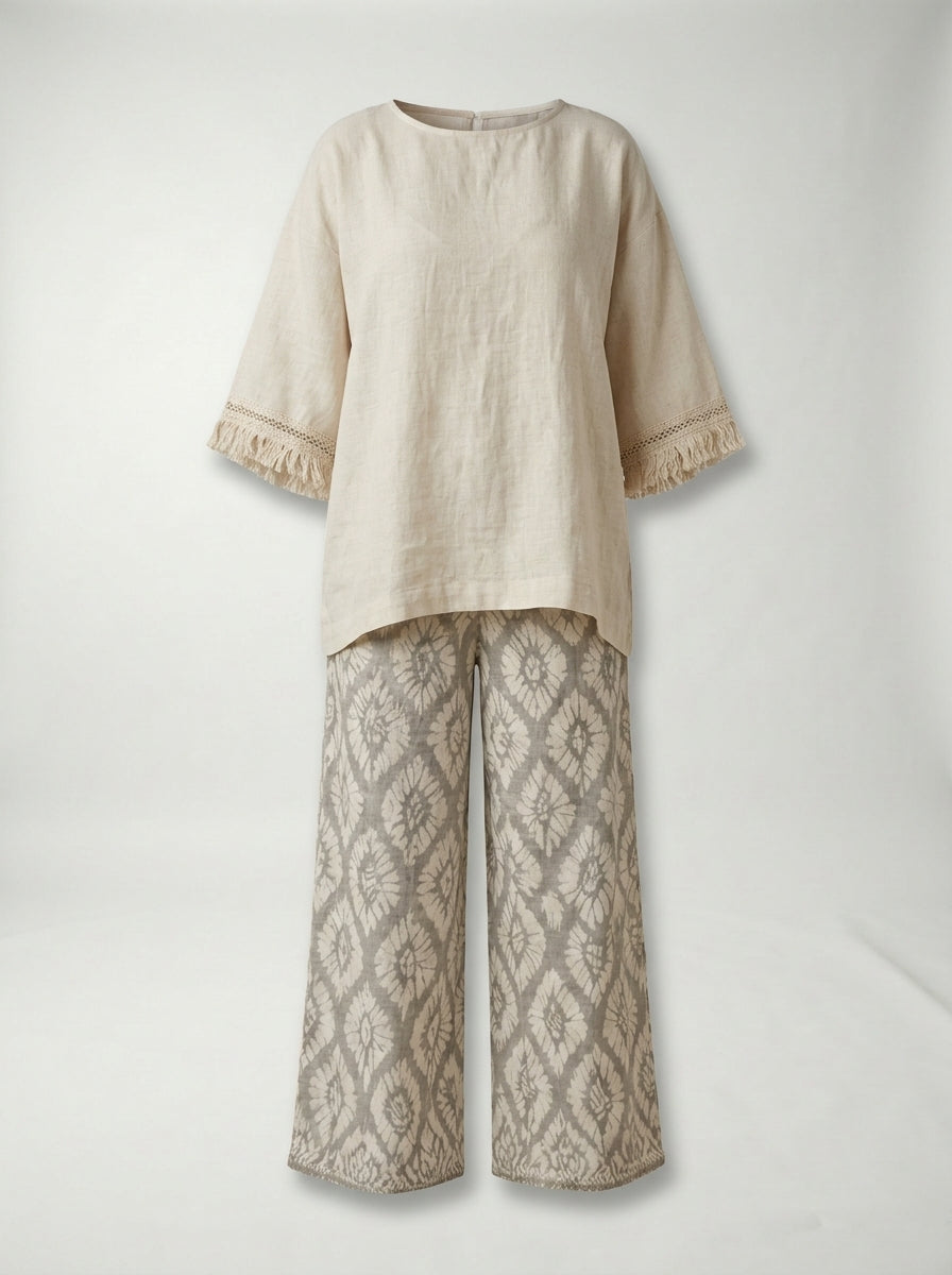 Conjunto ILARIA de dos piezas con blusa de flecos y pantalón estampado