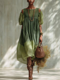 VESTIDO MIDI VERDE DE GASA CON HOMBROS DESCUBIERTOS Y MANGAS CORTAS.