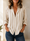 Blusa de rayas beige y blancas con escote en V