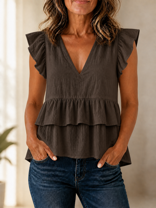 Blusa beige con volantes y escote en V